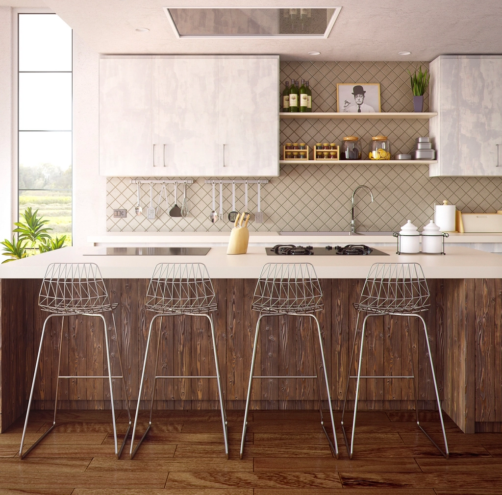 Kitchen with a warm wood island and white counter